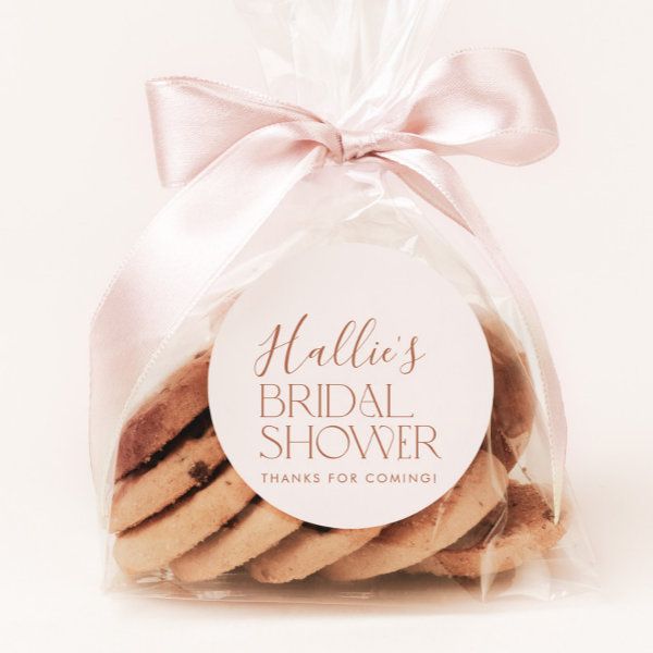 a package of cookies with a ribbon tied around the top and label that says, bridal shower thanks for coming