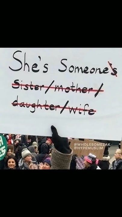 there is a sign that says she's someone's sister / mother, daughter / wife