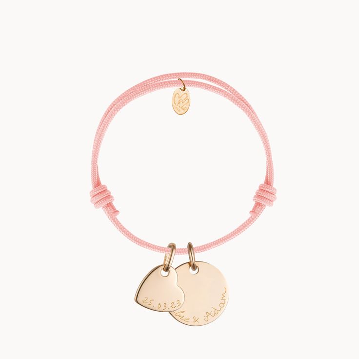 A keepsake as precious as the memories it holds, our Personalized Love Bracelet is a token of affection to treasure. Each bracelet features a mini disc with space to engrave the names of an inseparable pair, and a mini heart to personalize with the date of a special love story.&nbsp;18K Champagne Gold Plated, 925 Sterling Silver or 18K Rose Gold PlatedMini Flat Heart: 0.4 x 0.4Small Flat Disc: 0.6 DiameterBraid made of a durable, colorfast polyesterFully adjustable sliding knot fasteningHand Adjustable Heart Charm Bracelet For Promise, Adjustable Rose Gold Jewelry With Heart Charm, Adjustable Promise Jewelry With Heart Charm, Personalized Double Heart Adjustable Bracelet, Adjustable Rose Gold Sterling Silver Heart Bracelet, Personalized Adjustable Double Heart Bracelet, Personalized Double Heart Bracelet, Personalized Round Bracelets For Promise, Personalized Round Bracelet For Promise