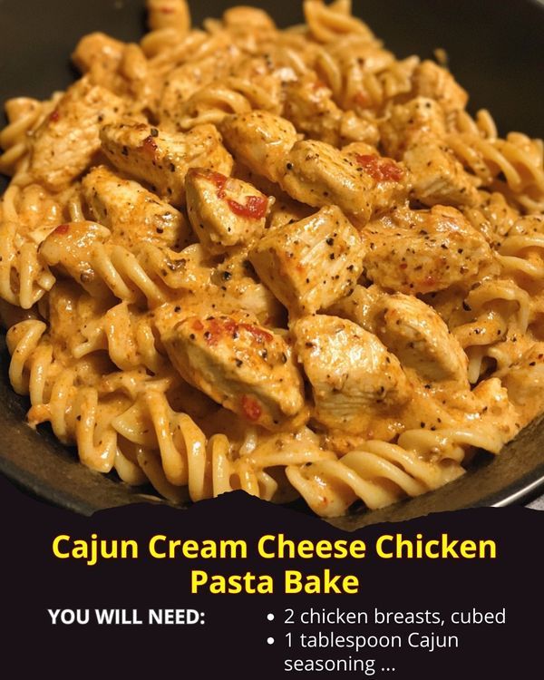 chicken pasta in a skillet with the words cajun cream cheese chicken pasta