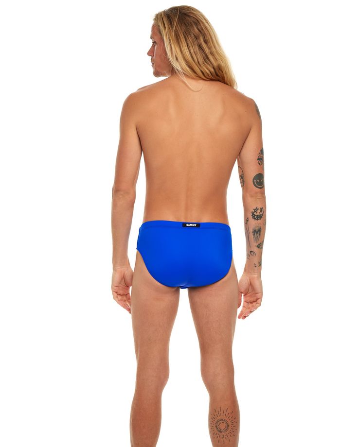 The Eco Swim Brief is made with Recycled Nylon. A sustainable techno-fabric with shape retention and UV protection. Designed to lift and accentuate the glutes. Three layers of lining for optimal frontal coverage. Custom drawstring with SAMMY logo tips. Wear this brief to the sand bar, or the beach bar! Functional Nylon Swimwear For The Beach, Sporty Stretch Swimwear Made Of Recycled Polyester, Athleisure Swimwear In Recycled Polyester, Sporty Elastane Swimwear For Sports, Blue Padded Swimwear For Swimming, Padded Stretch Swimwear For Sports, Sporty Stretch Swimwear In Recycled Polyester, Functional Sports Swimwear Made Of Elastane, Functional Stretch Swimwear In Recycled Polyester