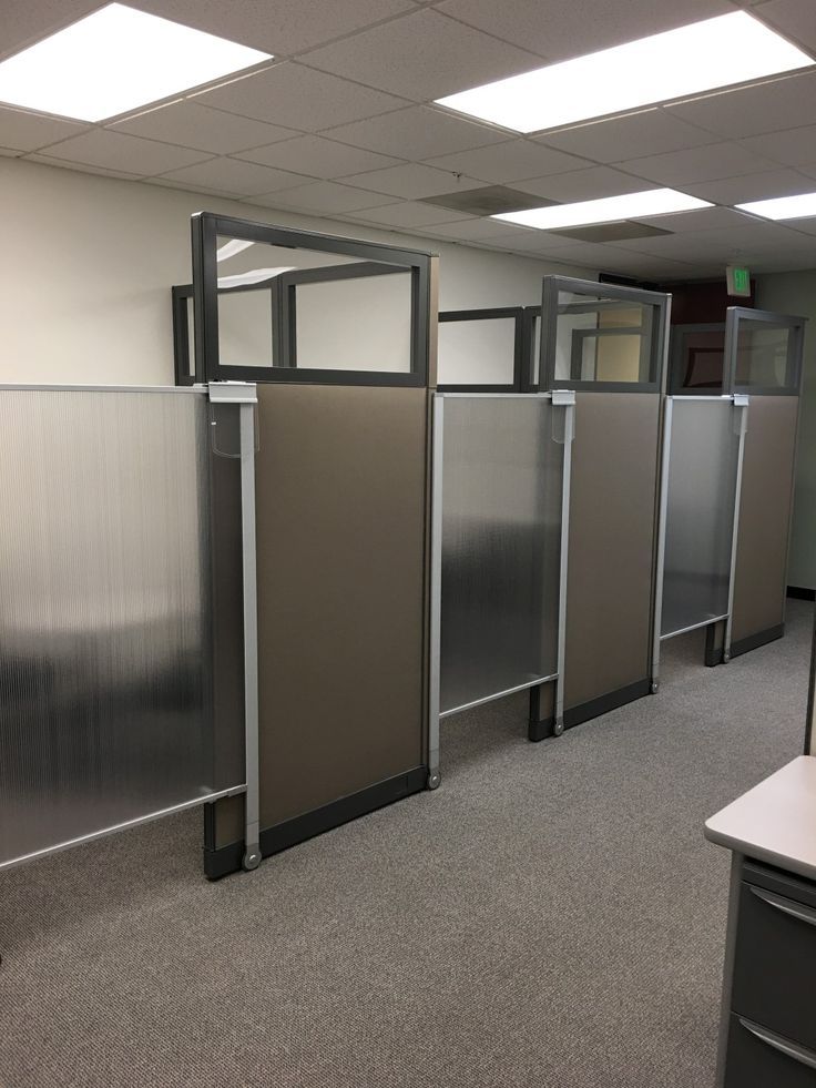 an empty office cubicle with several partitions