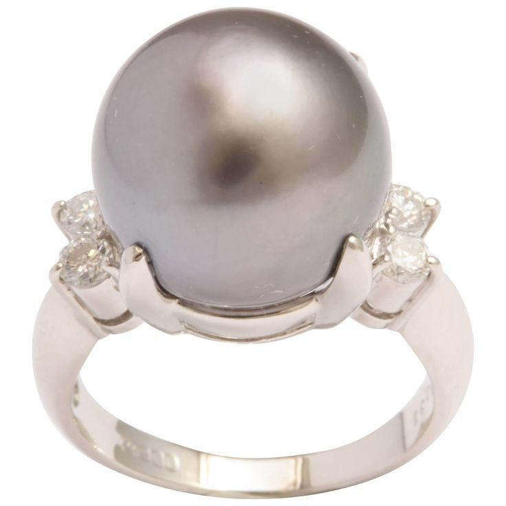 Platinum and 4 Diamond Ring giving an updated look to a traditional Pearl & Diamond Ring. Japanese made and centered on beautiful 13mm Grey South Sea Pearl with 2 round full cut stones on either side - totaling 25pts - just enough to brighten the Pearl - but not overpower it. Fits a size 6 3/4 but can be sized Pearl Diamond Ring, Pearl Cocktail Ring, South Sea Pearls Earrings, Cultured Pearl Ring, Pearl Earring Set, Green Sapphire Engagement, Cushion Cut Diamond Ring, Green Sapphire Engagement Ring, Radiant Cut Engagement Rings