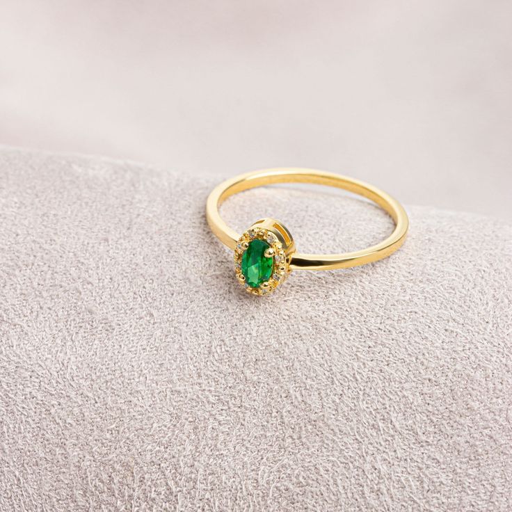 Emerald, which is considered to be the stone of love, sensitivity and loyalty, is seen as a symbol of harmony in relationships. Our oval emerald and diamond ring is both stylish and suitable for daily use. Bring a smile to your loved ones' faces by gifting them on their birthday, graduation day, wedding anniversaries and many more special occasions.   Emerald is the birthstone of May. Our necklace compatible with our ring: https://queenjewelryturkey.etsy.com/listing/1391092889/oval-cut-real-diam Formal Diamond Ring With Halo For May Birthstone, Oval Yellow Gold Emerald Ring With Halo, Elegant Christmas Diamond Jewelry, Elegant Emerald Cubic Zirconia Ring With Halo, Elegant Emerald Ring With Halo In Cubic Zirconia, Elegant Emerald Halo Ring With Cubic Zirconia, Formal 14k Gold Emerald Ring With Halo, Elegant Christmas Jewelry For Formal Occasions, Elegant Christmas Formal Jewelry