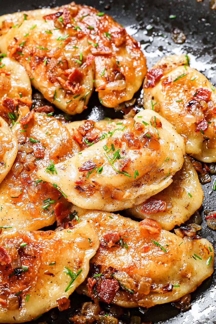 some food is cooking in a skillet on the stove and ready to be eaten