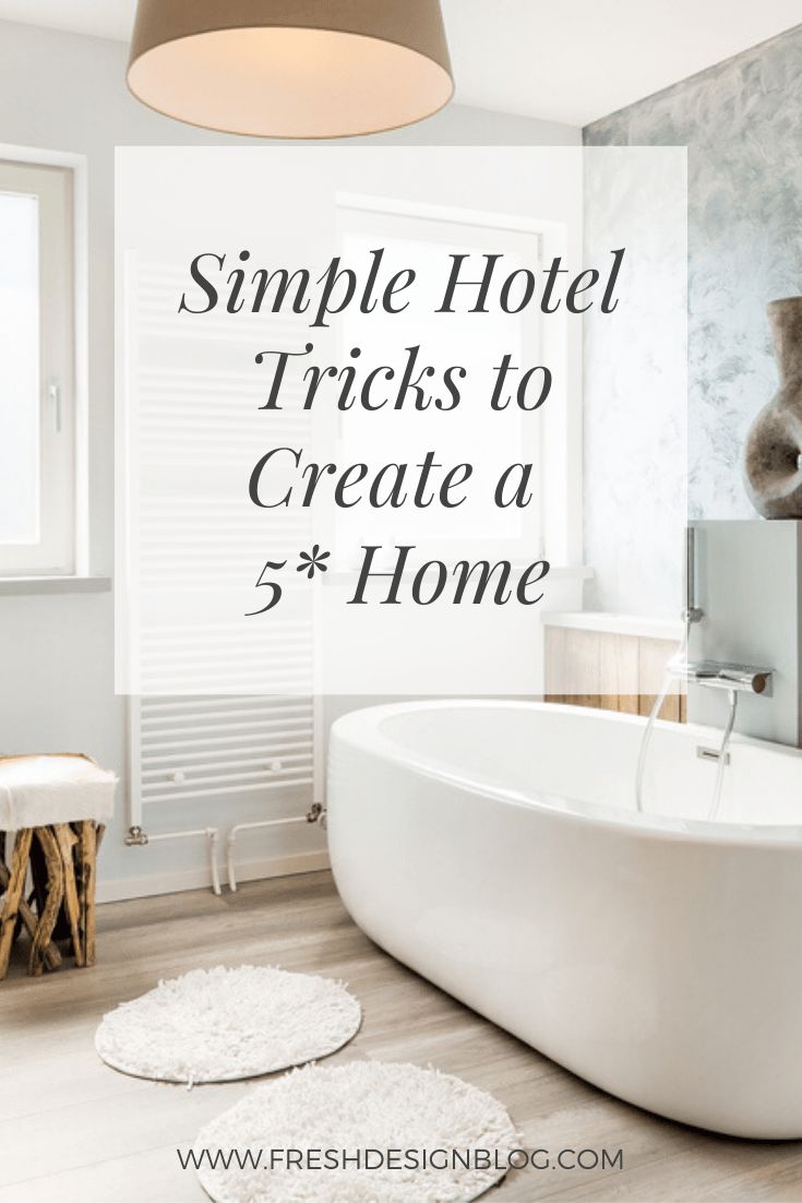 a white bath tub sitting in a bathroom next to a sink and window with the words simple hotel tricks to create a 5 - home