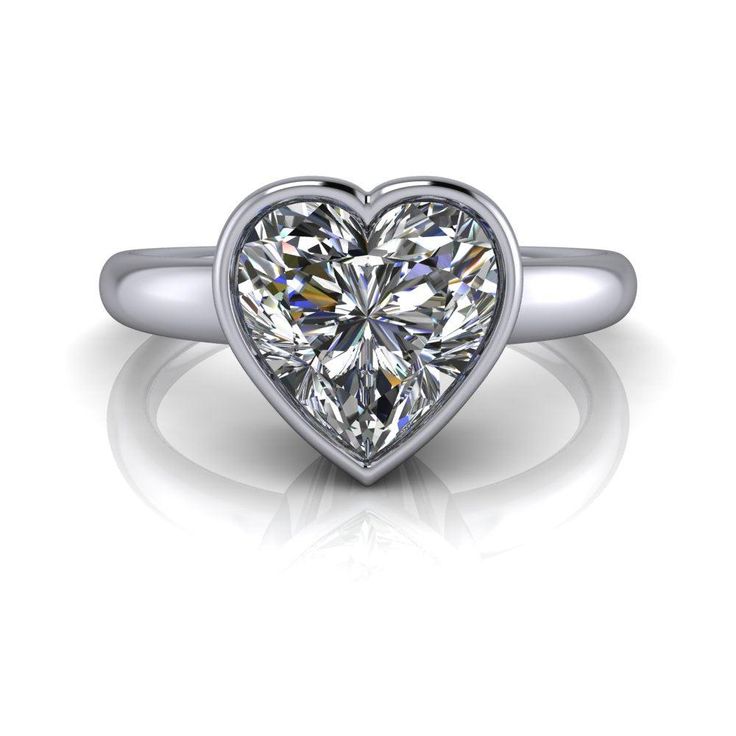 Solid Silver Solitaire ring shown with an 8mm, 2.00 ct. heart shape colorless simulated diamond. Band width 2.2mm tapered to 2mm.2.00 carat total weight. *Sterling Silver is Rhodium dipped to reduce tarnishing. Rhodium is a very strong metal that creates a protective layer over the sterling silver, making it more resistant to tarnishing.*Custom made at the time of order. Moissanite Round Cut Diamond Ring For Valentine's Day, Valentine's Day Moissanite Diamond Ring With Round Cut, Heart Shaped Moissanite Diamond Ring With Brilliant Cut, Heart Cut Diamond White Ring For Proposal, Heart Cut Diamond Rings For Proposal, Classic Solitaire Diamond Ring For Valentine's Day, Vvs Clarity Round Cut Ring For Valentine's Day, Valentine's Day Solitaire Diamond Ring, Moissanite Heart Cut Diamond Ring For Valentine's Day