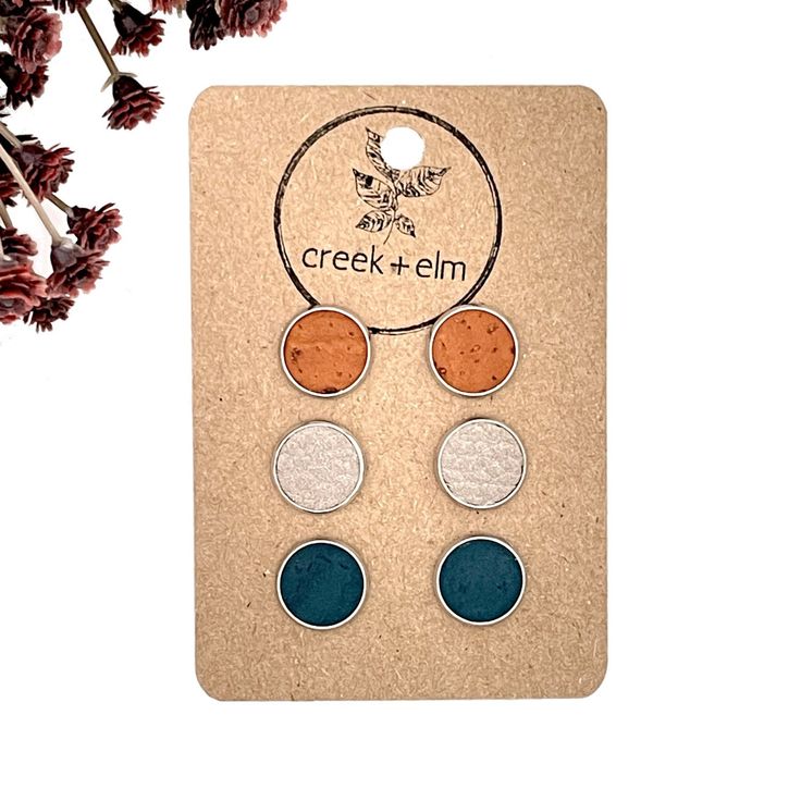 These studs are SO cool! They are small enough not to be distracting, but big enough that the little pop of color they add to your outfit is sure to make you stand out. Made from a variety of eco-friendly cork and vegan faux leather, you can be sure that your choices are making the world a better place. Details Stainless steel, hypoallergenic, nickel-free All earrings come in a set of 3 and will be the same size and same hardware you choose Model shown is wearing the 12mm size Diy Earrings Studs, Leather Stud Earrings, Cricut Earrings, Earring Ideas, Homemade Jewelry, Stud Set, Stud Earrings Set, Felt Flowers, So Cool