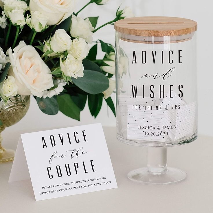 there is a candle and some flowers on the table next to this card that says advice for the couple