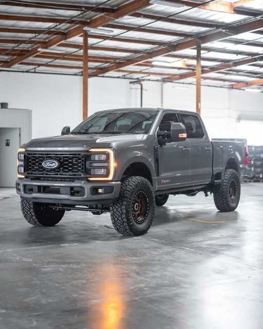 a large gray truck parked in a garage