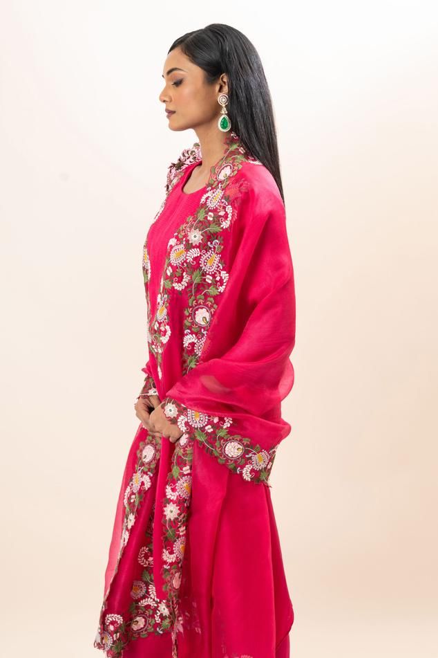 Fuchsia kurta with floral bloom embroidery. Paired with a pant and dupatta.
Components: 3
Pattern: Hand Embroidery
Type Of Work: Floral, Thread
Neckline: Round Neck
Sleeve Type: Three Quarter Sleeves
Fabric: Kurta: Modal Satin, Pant: Modal satin, Dupatta: Silk organza
Color: Pink
Other Details: 
Floral embroidered border on dupatta
Closure: Elastic
Occasion: Puja - Aza Fashions Diwali Wedding Churidar With Floral Embroidery, Semi-stitched Slub Silk Salwar Kameez With Floral Embroidery, Pink Dola Silk Sets With Floral Embroidery, Pink Raw Silk Salwar Kameez With Floral Embroidery, Anarkali Art Silk Sharara With Floral Embroidery, Traditional Raw Silk Sharara With Floral Embroidery, Anarkali Dola Silk Traditional Wear With Floral Embroidery, Art Silk Churidar With Floral Embroidery For Wedding, Floral Embroidered Raw Silk Sharara