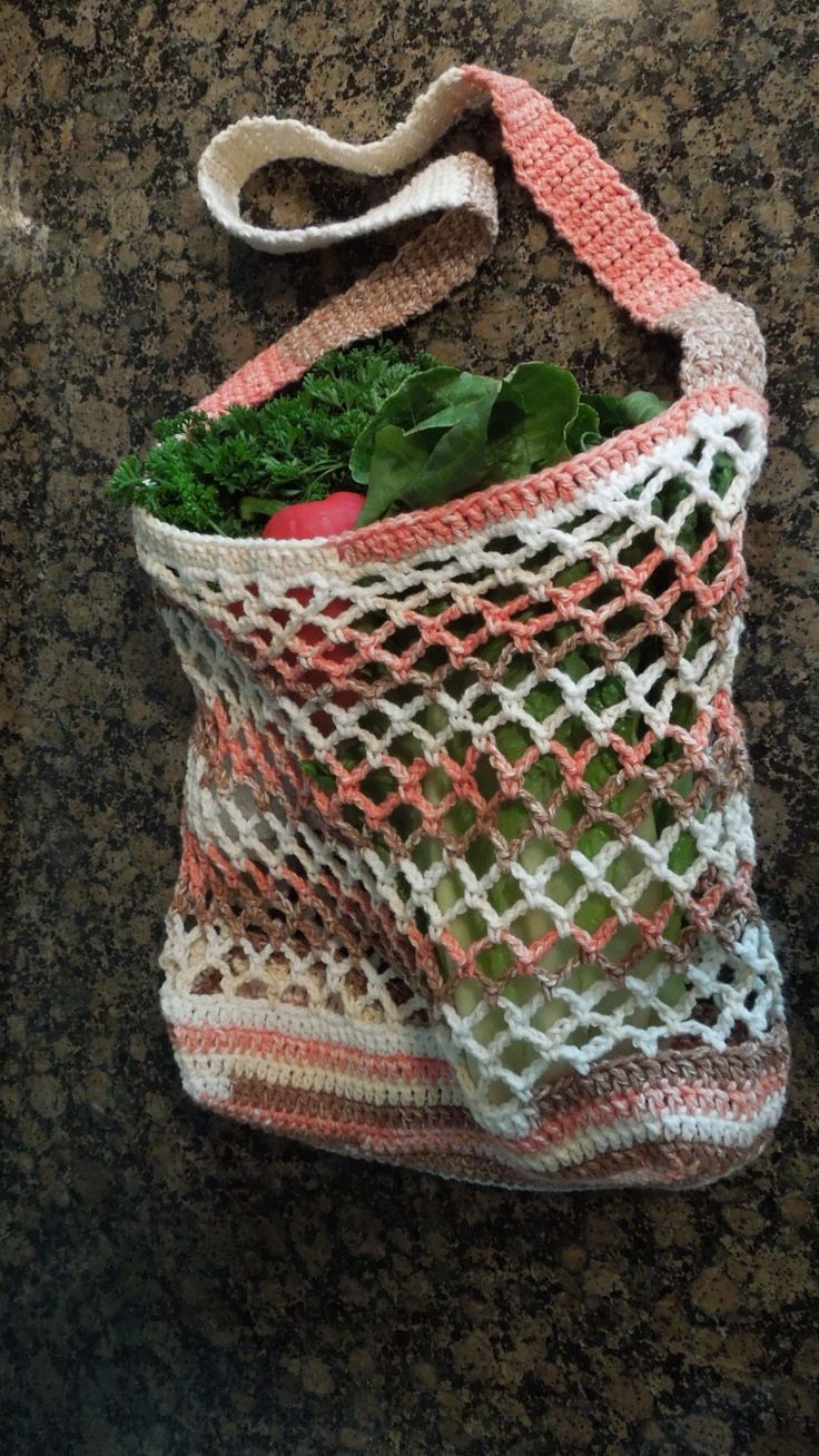 a bag filled with vegetables sitting on top of a counter