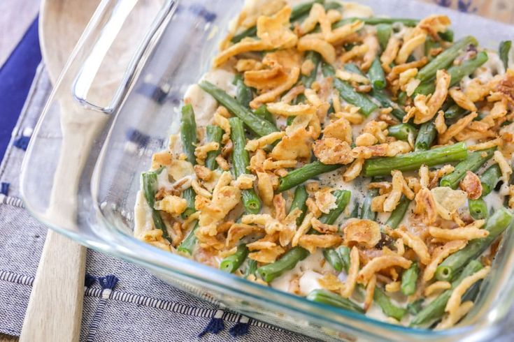 a casserole dish with green beans and onions