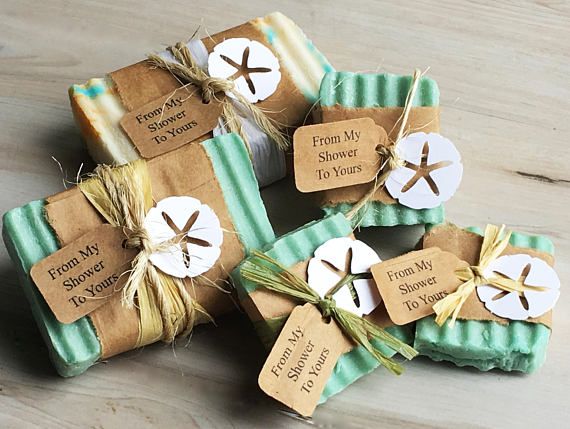 four soap bars wrapped in brown paper and tied with twine