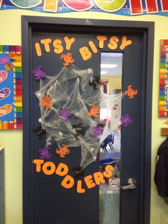 a classroom door decorated with halloween decorations