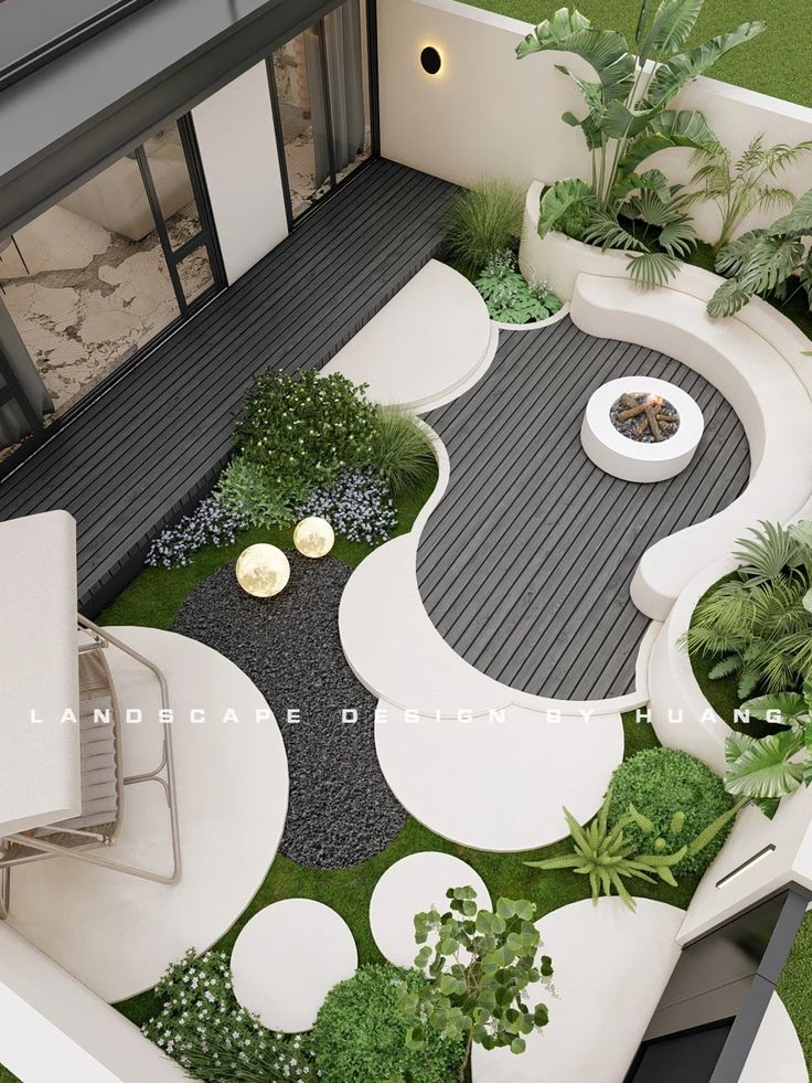 an aerial view of a modern garden with white furniture and green plants on the ground