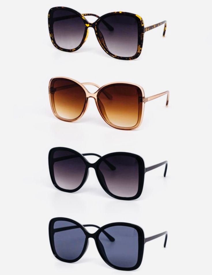 three pairs of sunglasses sitting next to each other