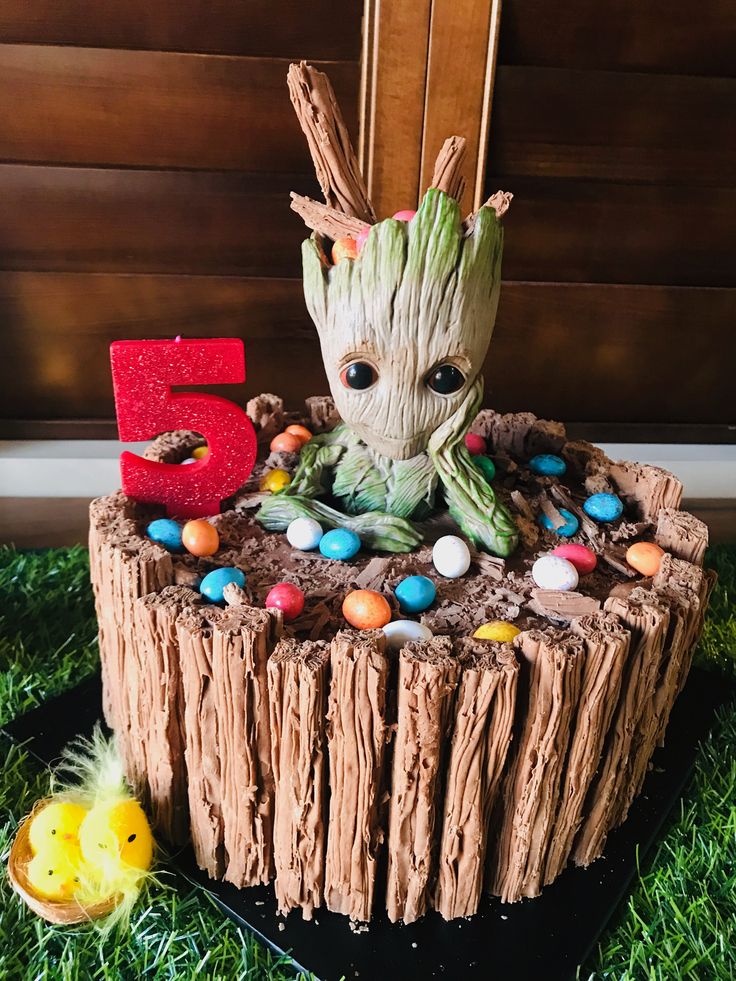 a cake made to look like a baby groote with candy and candies