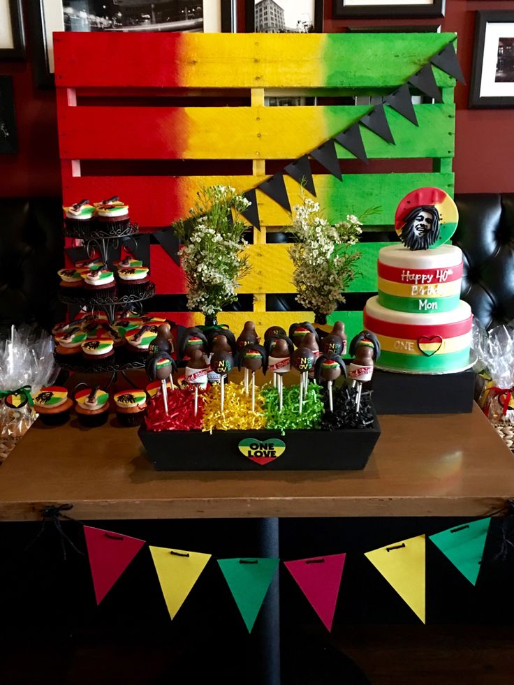 a table topped with lots of cakes and desserts