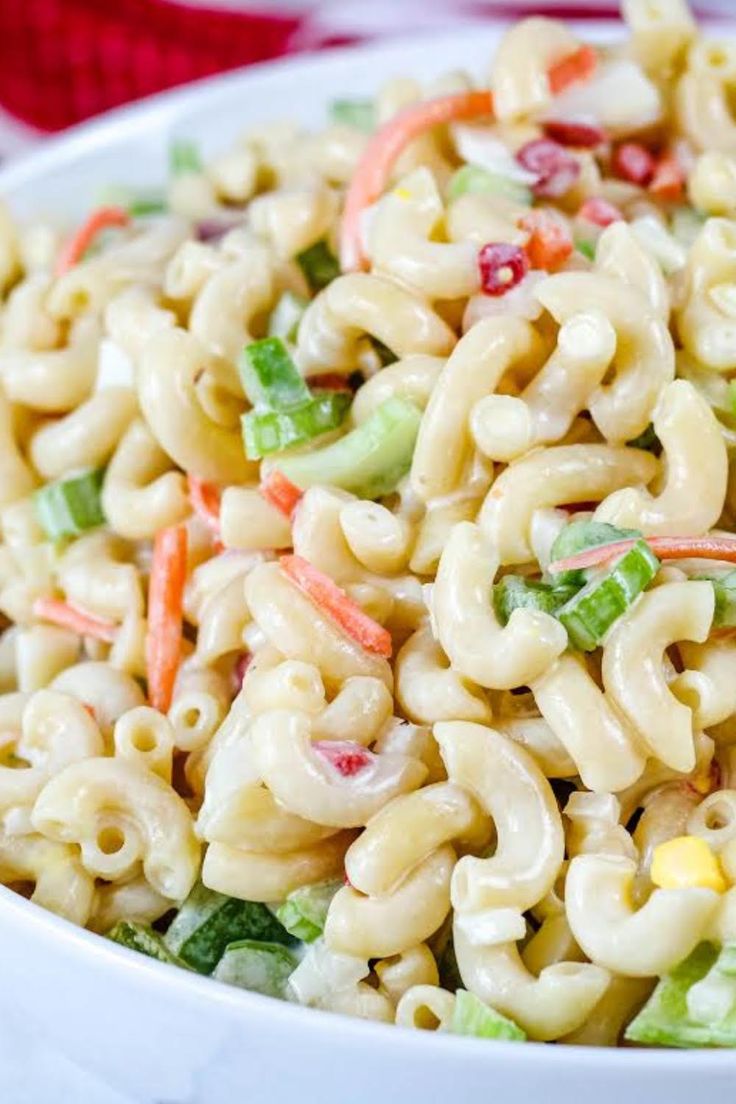 macaroni salad in a white bowl with the title above it