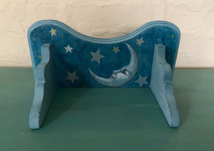 a blue bench with stars and a crescent on it