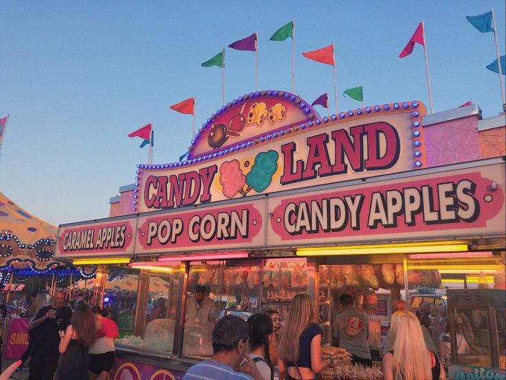 many people are standing in line at the candy land