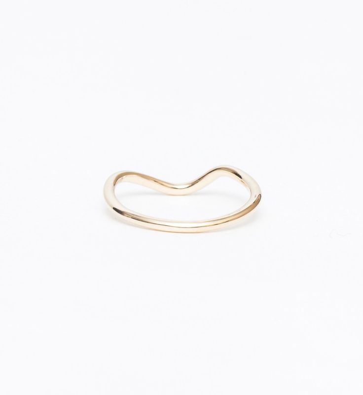 The momentary beauty of waves lapping the shore stays with you always with this slender, curved gold band. Though it was designed to complement the diamond-set Masumi Ring, this ring's soft, asymmetric form brings unexpected grace to any suite of rings. Wear it alongside flat, straight bands for a sculptural accent to your stack. Made in the U.S.A. All sizes available by special order in 3-4 weeks. To inquire, including alternate metal options, please contact us. 14 karat gold. Contour Band, Diamond Set, Gold Band, Gold Bands, Rose Gold Ring, Heart Ring, Gold Rings, Rose Gold, Sculpture