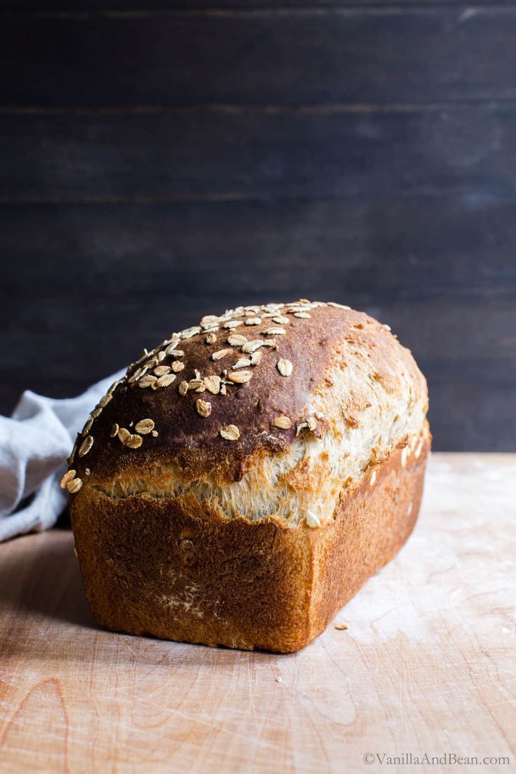 a loaf of bread sitting on top of a wooden table