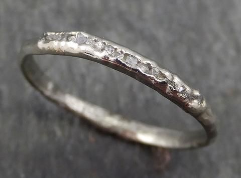 a silver ring with small stones on it