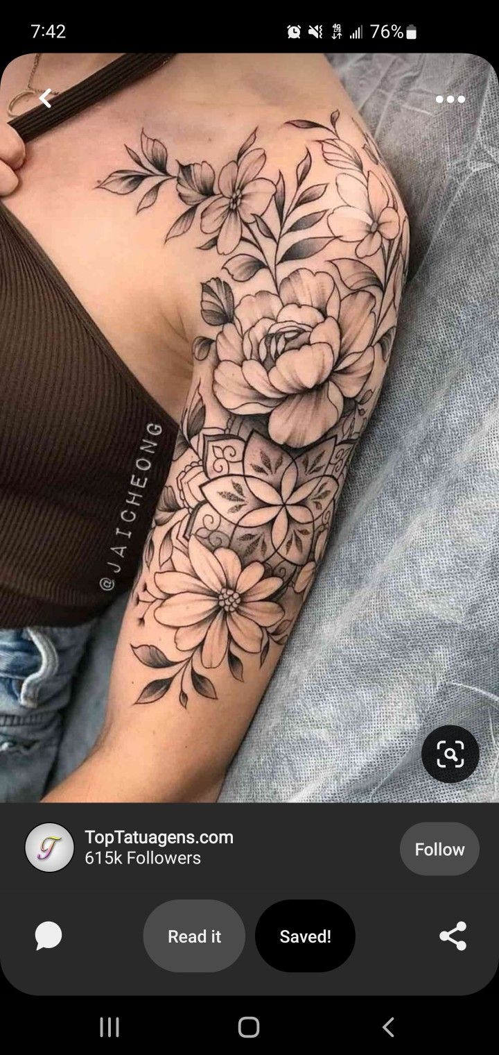 a woman's arm with flowers on it