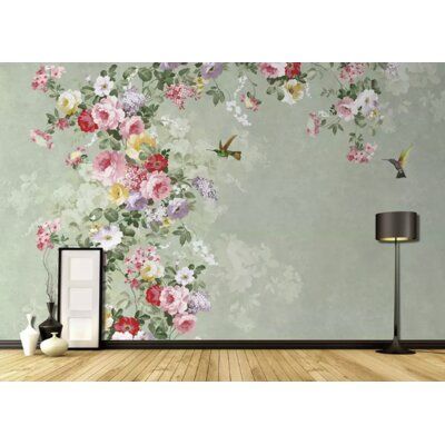 an empty room with flowers on the wall and a bird flying in the sky above