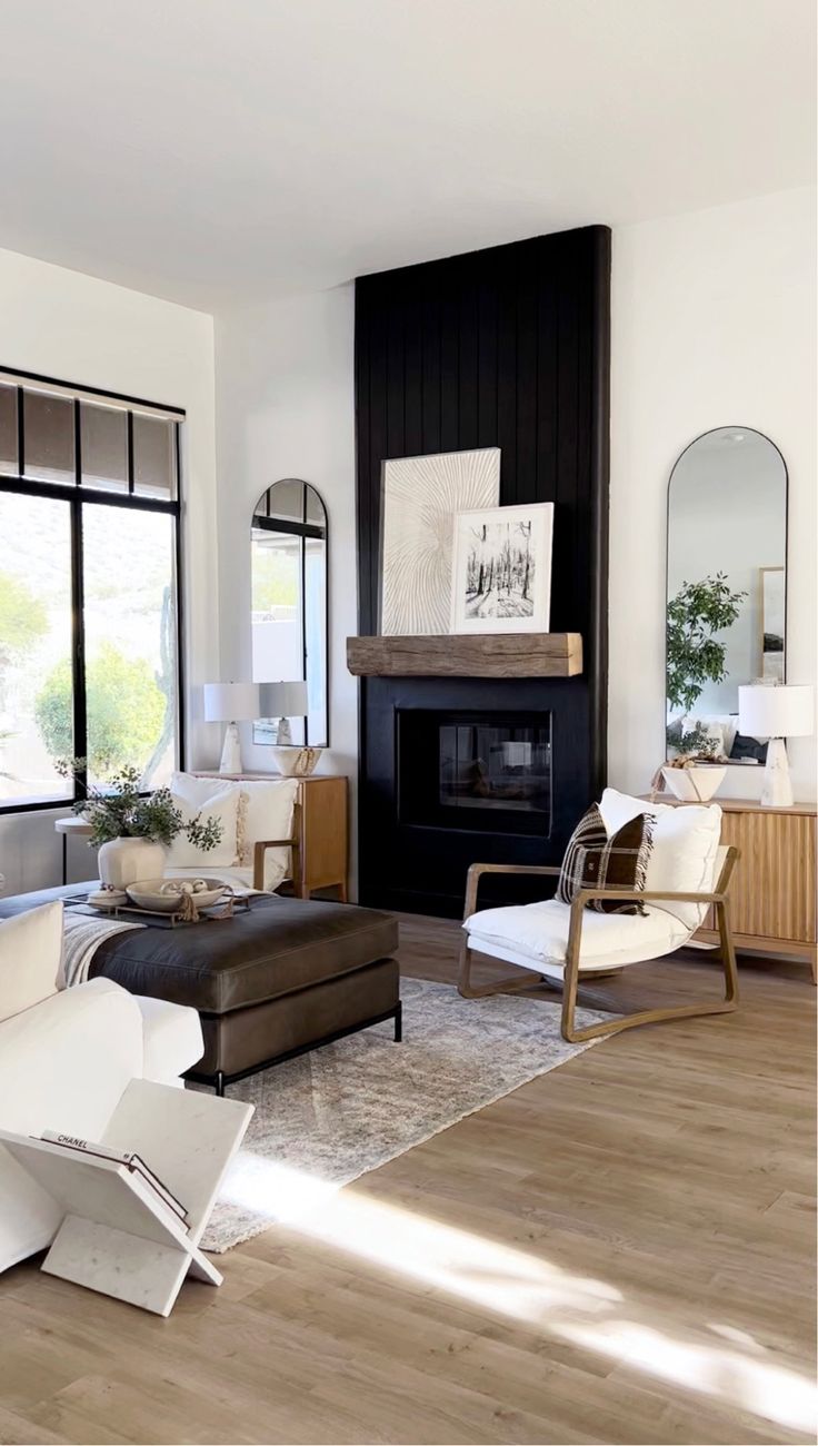 a living room filled with furniture and a fire place