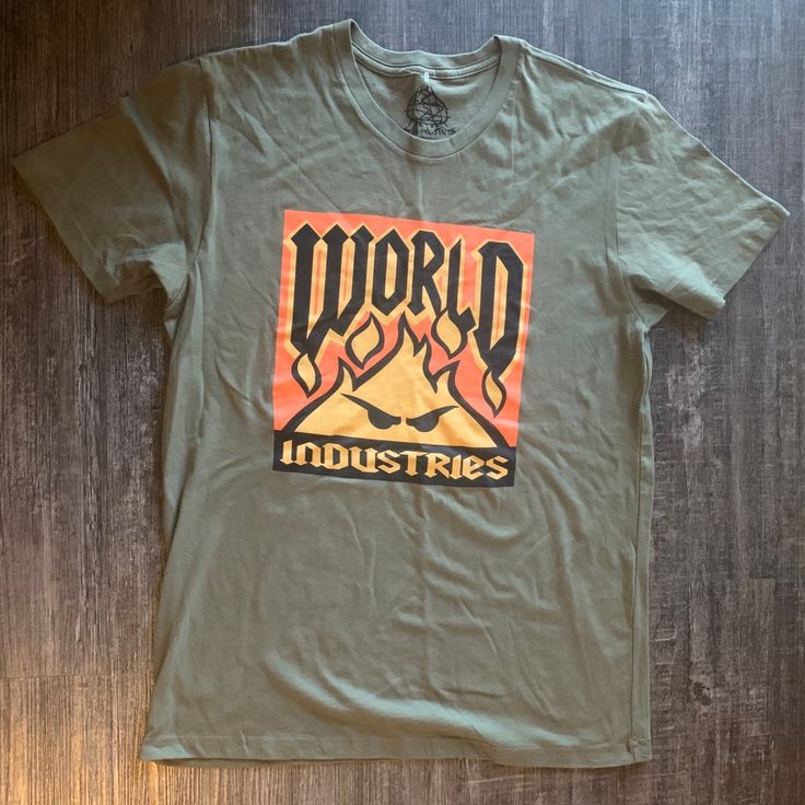 World Industries T-Shirt Brand New Comes With Tags Rare Find ! #Worldindustries #Retro #Vintage #90s #Depopfamous 90s Cotton T-shirt With Front Print, Graphic Cotton Tee For Urban Adventures, Graphic Tee Cotton Top For Urban Adventures, Retro Green T-shirt For Streetwear, Orange Graphic Print Tops For Streetwear, Orange Graphic T-shirt For Streetwear, Orange Graphic Design T-shirt For Streetwear, 90s Style Cotton T-shirt With Front Print, Retro Orange T-shirt With Screen Print