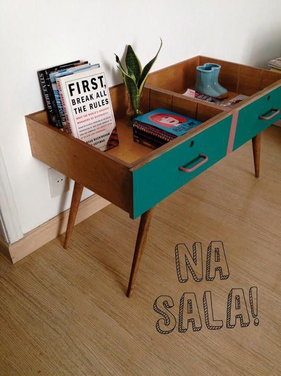 a table with some books on it and a plant in the middle that has been turned into a book shelf