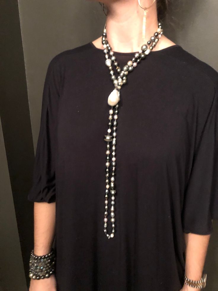 132 South Sea, Tahitian, and Akoya pearls are hand-knotted on silk. A rare “cake-pop” Baroque pearl hangs central to this necklace. Can be worn long, doubled, or three times around the neck. No clasp. 66" with 1.5" drop.