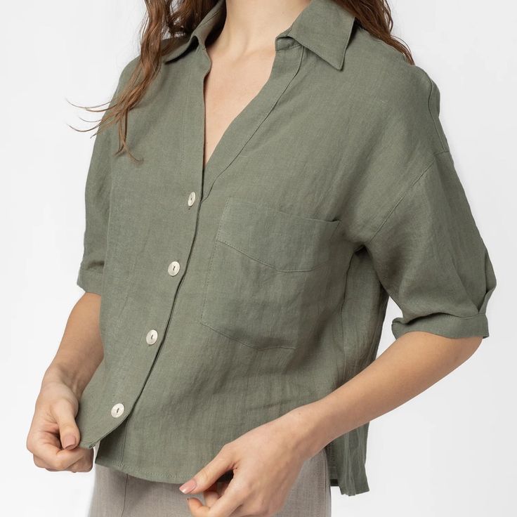 Never Worn. Lightweight Short Sleeve Shirt. The Dawn Top Features A Deep V-Neckline And Buttons Down The Front. This Style Is Perfect For Vacation And Summer Days. - 100% Linen - V-Neck - Collared Relaxed Fit V-neck Top With Button Closure, Olive Short Sleeve Top For Summer, Olive Collared Top For Spring, Solid Linen V-neck Shirt, Olive Button-up Top For Summer, Olive Tops For Summer Workwear, Olive Button-up Summer Top, Versatile Green Button-up Top, Olive V-neck Tops For Spring