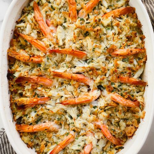 a casserole dish filled with shrimp and rice