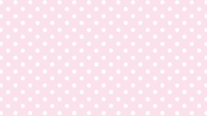 a pink background with white polka dots