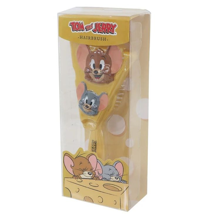 a yellow toothbrush with two cartoon mouses on it's head in a box