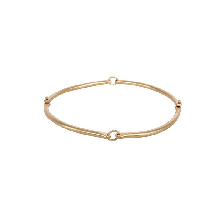 Hilary's classic bangle bracelet looks great with every outfit, and layers well with your bracelet stack. The perfect day-to-night bangle with a slinky movement that provides for ultra comfort. An essential in every jewelry collection. Choose from 14k or 18k gold. 2 1/2 inch diameter typically, but can be customized to fit. Rivet and Ring bangle can be customized with gold and silver links upon request. Made to order and will ship in 3-4 weeks. Chic Stackable Bangle For Everyday Wear, Chic Stackable Bangles For Everyday, Dainty Everyday Luxury Bangle Bracelets, Chic Everyday Stackable Bangle, Everyday Luxury Dainty Bangle Bracelet, Elegant Yellow Gold Bangle For Everyday, Everyday Minimalist Flexible Gold Bracelet, Elegant Bangle Bracelet With Spring Ring Clasp, Modern Stackable Bangle Bracelets