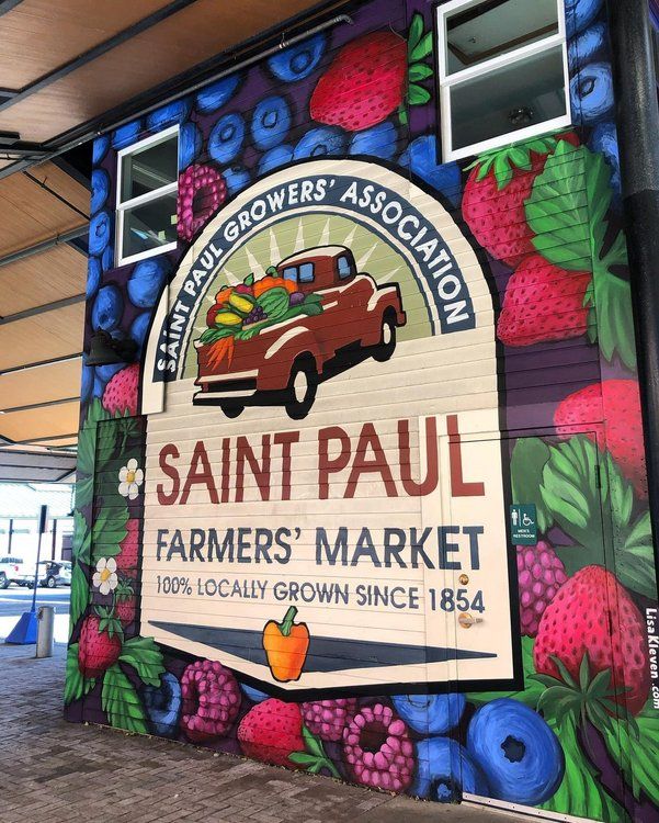 the sign for saint paul farmers'market is painted on the side of a building