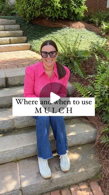 a woman sitting on the steps in front of her house holding a sign that says where and when to use mulch