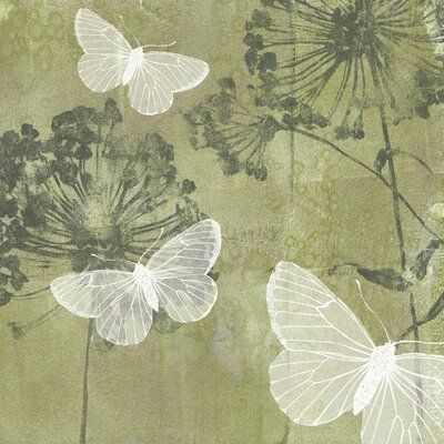 three white butterflies flying in the air over green leaves and flowers on a beige background