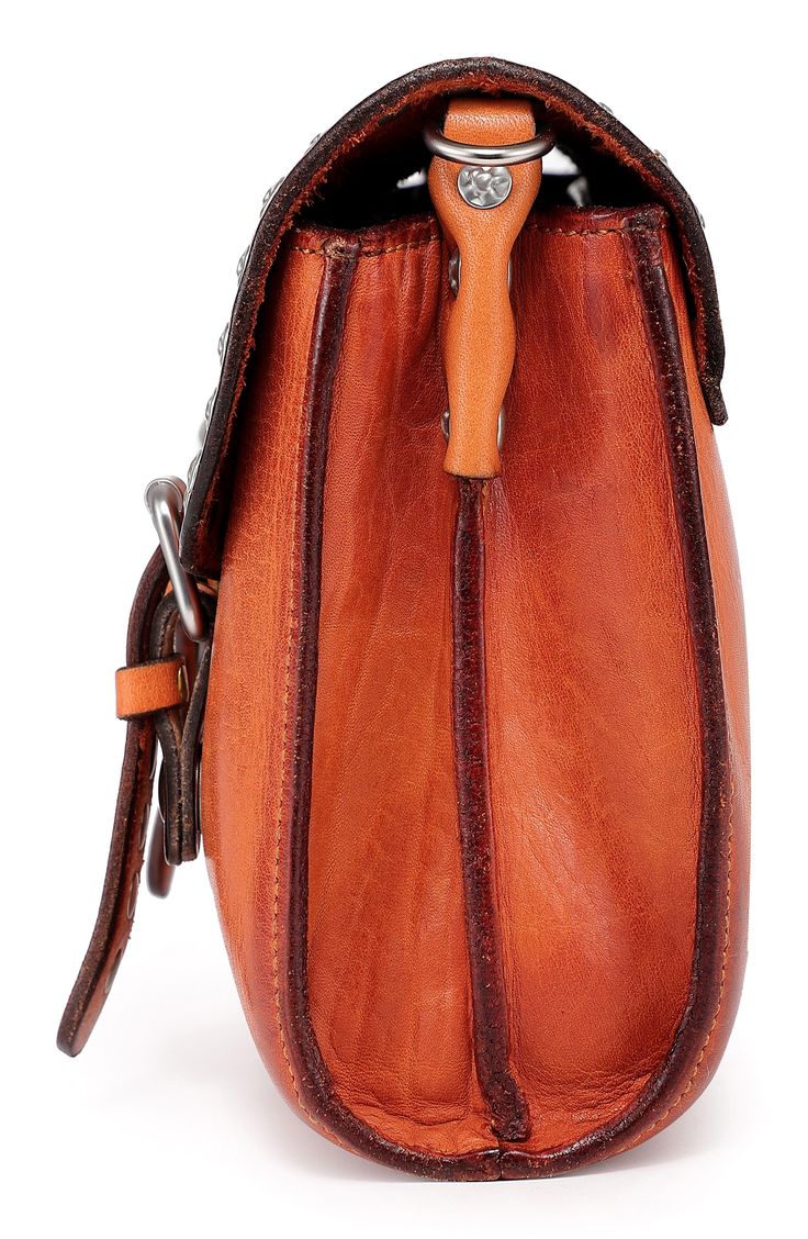 A classic and compact crossbody bag designed with rich leather and stylish exposed stitching makes it an amazing everyday go-to. Front flap closure Removable, adjustable crossbody/backpack strap Lined Leather Imported Travel Saddle Bag With Adjustable Strap, Business Cognac Crossbody Saddle Bag, Business Cognac Saddle Bag Crossbody, Cognac Saddle Bag With Leather Lining, Cognac Saddle Bag For Business, Travel Saddle Flap Bag With Adjustable Strap, Cognac Crossbody Flap Bag With Adjustable Strap, Cognac Leather Saddle Shoulder Bag With Leather Lining, Cognac Saddle Bag In Soft Leather