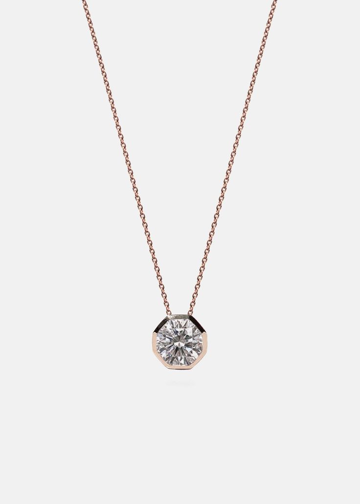 —Cosma Collection Clean forms showcasing the beauty of gold and diamonds. The Cosma Diamond Necklace showcases a 0.50ct brilliant cut diamond hand set in our signature 18K gold octagon pendant that floats on a 18" diamond cut cable chain. Diamond Grade: F/G color, VS clarity For custom lengths or variations, email us at info@katkimfinejewelry.com Available in Yellow Gold, White Gold — Platinum upon request. Please note: All our pieces are custom made to order and requires 2-4 weeks for productio Accessories Necklaces, Solitaire Diamond Pendant, Chain Diamond, Diamond Pendants, Diamond Settings, Solitaire Pendant, Flower Jewelry, Diamond Pendant Necklace, Diamond Design