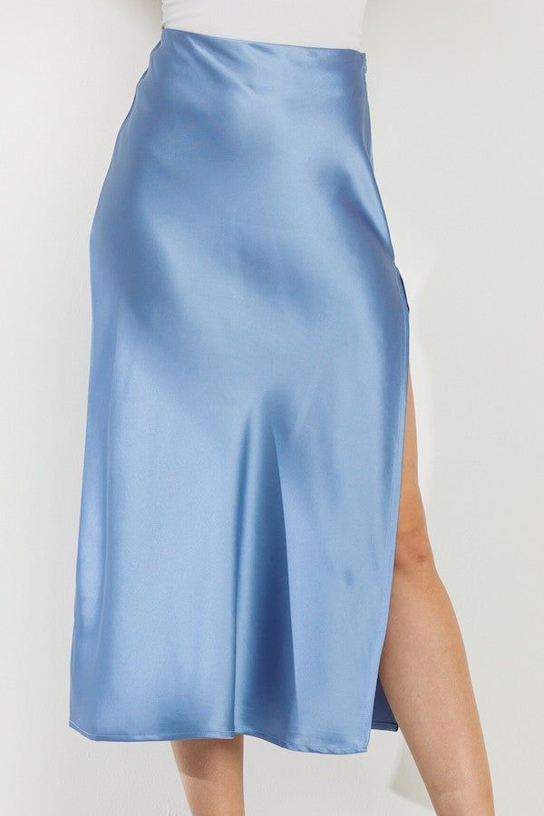 Experience the ultimate comfort and elegance with our Time Slipped Away Satin Midi Skirt in Blue! Featuring a soft, blue color and a flowy design, this slip skirt is perfect for any occasion. Made with luxurious satin material, it's the perfect addition to your wardrobe. Let time slip away in style!Styling Tip: Pair it with a graphic Tee and wide brim hat for an easy day look or dress it up with a spicy top for date night! Material Content: 98% Polyester 2% Spandex Luxury Elegant Blue Bottoms, Luxury Blue Skirt Bottoms, Luxury Blue Tops For Night Out, Luxury Blue Flowy Midi Dress, Luxury Blue Satin Dress For Night Out, Luxury Blue Midi Skirt, Flowy Design, Easy Day, Satin Midi Skirt