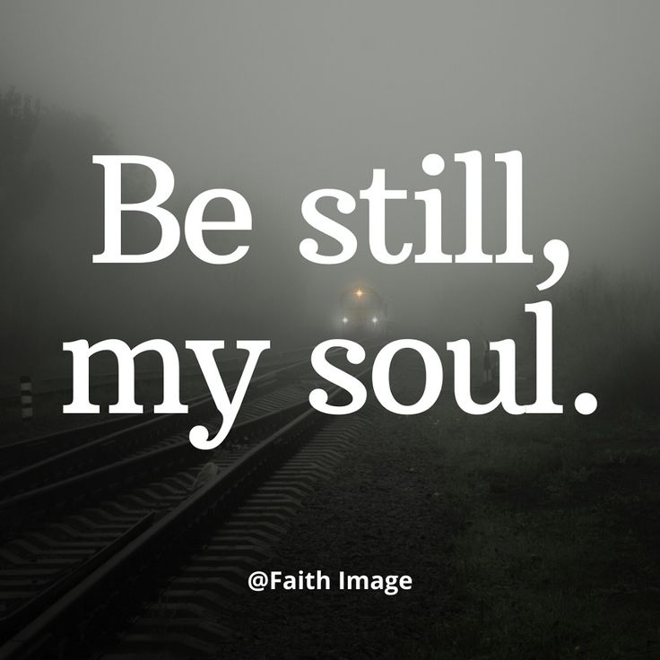 a train traveling down tracks with the words be still, my soul