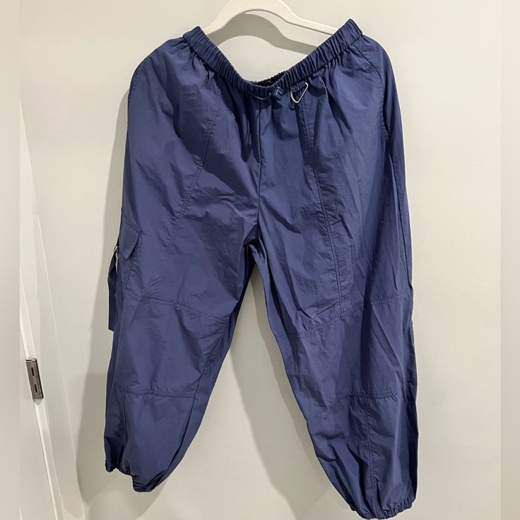 Uo Sloan Nylon Baggy Balloon Pant In Blue, Size Small Nwt Blue Utility Cargo Pants For Outdoor, Outdoor Blue Pants With Cargo Pockets, Blue Utility Pants For Summer, Blue Cargo Pants For Outdoor, Blue Cargo Style Pants For Outdoor, Blue Utility Cargo Pants For Summer, Blue Parachute Pants With Side Pockets For Spring, Casual Blue Parachute Pants For Outdoor, Blue Baggy Bottoms For Outdoor