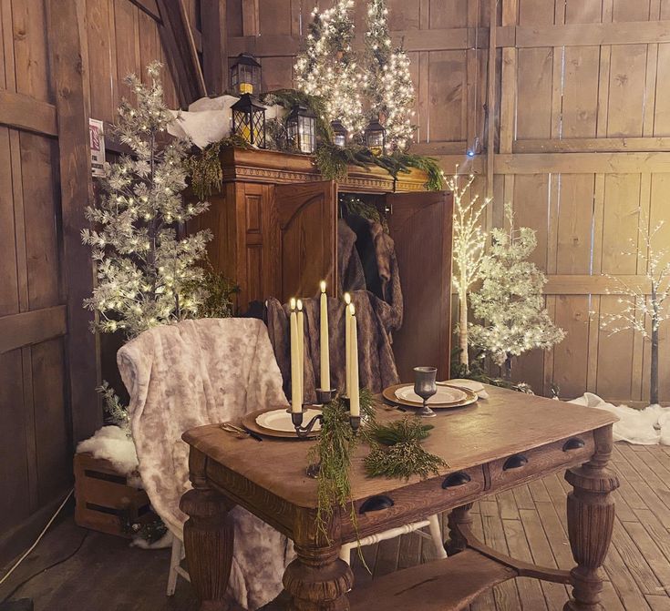 a dining room table with candles on it