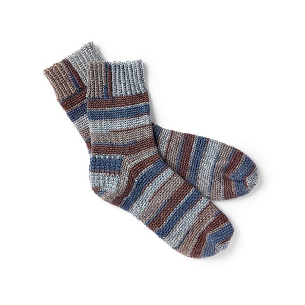 two pairs of striped socks sitting next to each other on top of a white surface